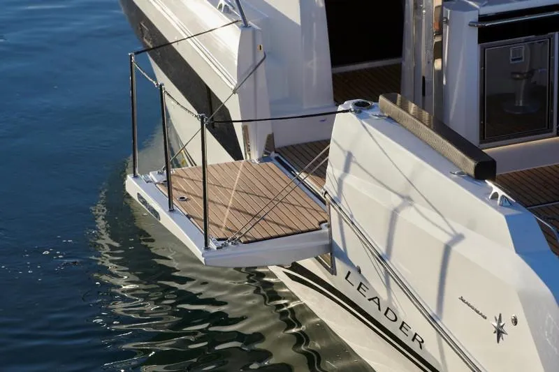 Slide: The Image of 2026 Jeanneau Leader 10.5 WA yacht with open deck platform on water. - 6