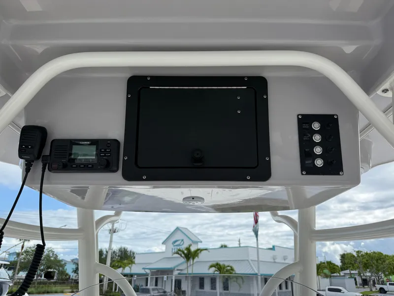 Slide: The Image of 2025 Sea Born SX281 boat console with radio and control panel. - 12