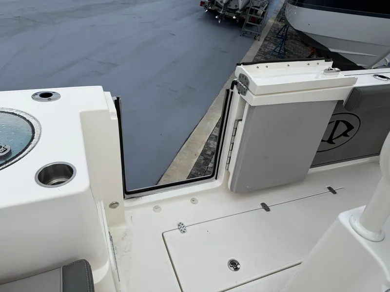 Slide: The Image of 2025 Sea Born SX281 boat deck with open side door, showcasing sleek design and functionality. - 14