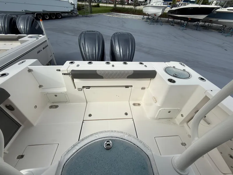 Slide: The Image of 2025 Sea Born SX281 boat deck with twin engines, spacious layout, and storage compartments. - 6