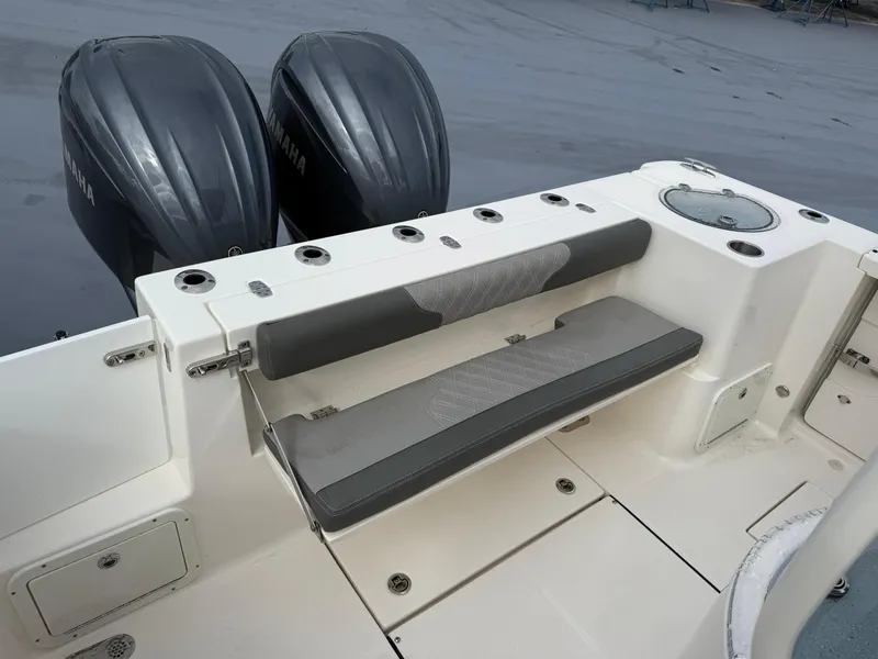 Slide: The Image of 2025 Sea Born SX281 boat with dual engines and seating area. - 7