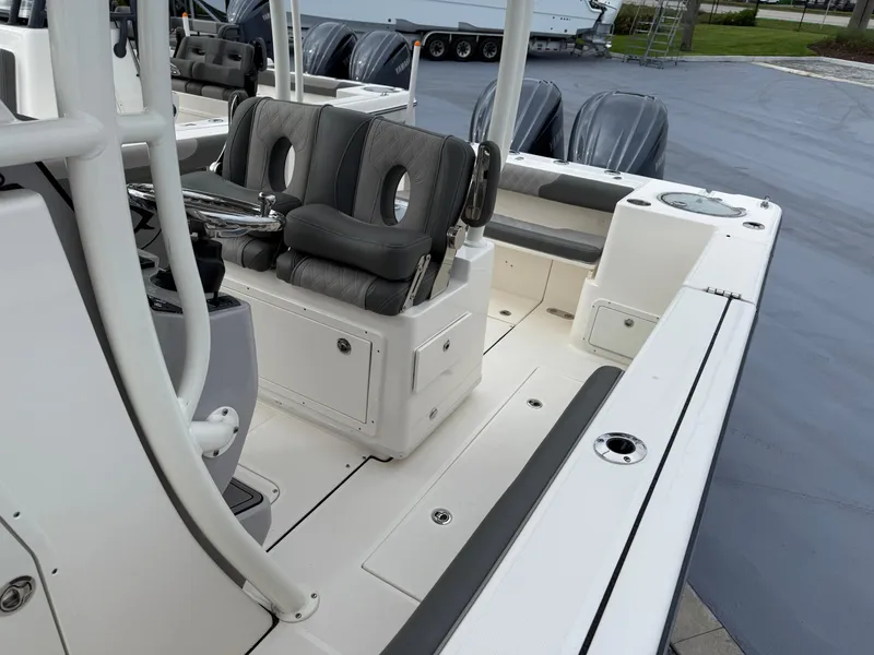Slide: The Image of 2025 Sea Born SX281 boat interior with seating and dual outboard motors. - 8
