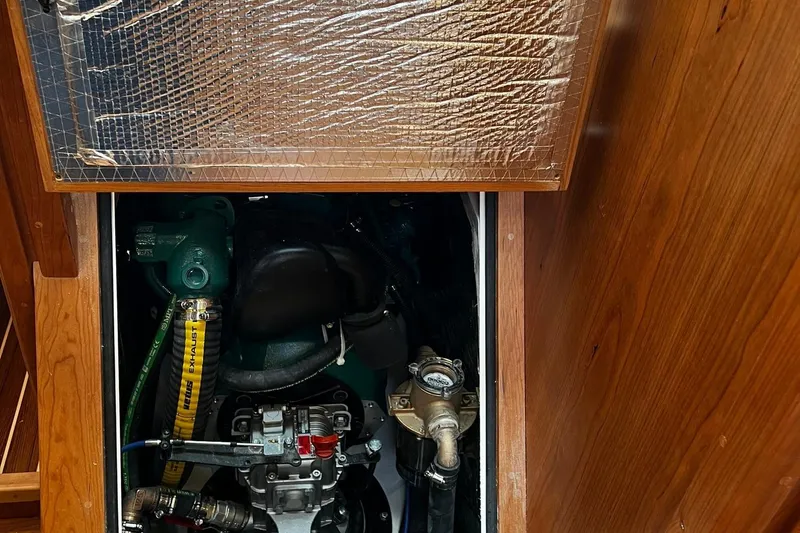Slide: The Image of Engine compartment of 2025 Tartan 395 sailboat, showcasing mechanical components and insulation. - 25