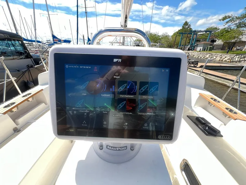 Slide: The Image of Touchscreen navigation system on 2025 Tartan 395 yacht, docked at marina. - 4