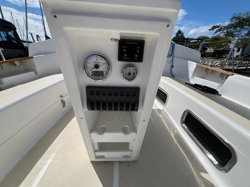Slide: The Image of 2025 Tartan 395 sailboat cockpit with control panel and gauges. - 5