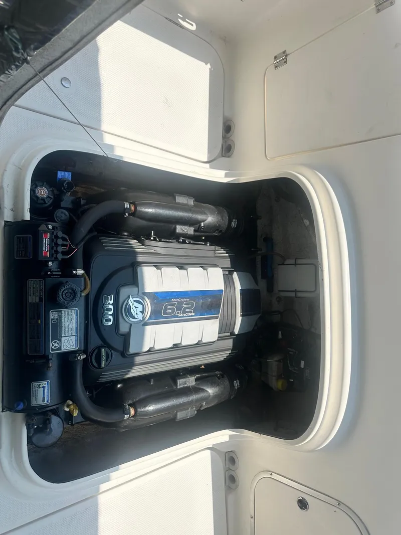 Slide: The Image of 2004 Trophy 2359 Hardtop interior cabin with storage and anchor. - 17