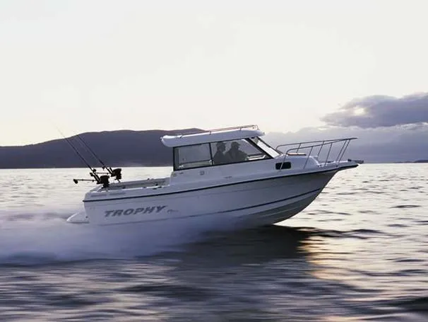 Slide: The Image of Storage compartment on a 2004 Trophy 2359 Hardtop boat with ropes and equipment. - 19