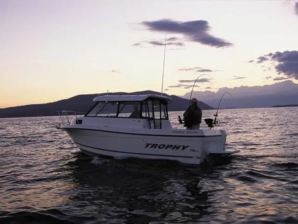 Slide: The Image of 2004 Trophy 2359 Hardtop boat storage compartment with open hatch. - 20