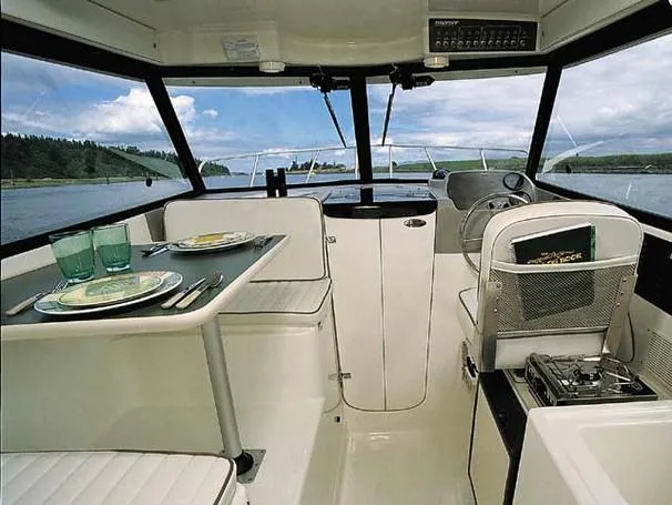 Slide: The Image of Engine compartment of a 2004 Trophy 2359 Hardtop boat, showcasing a powerful engine. - 22