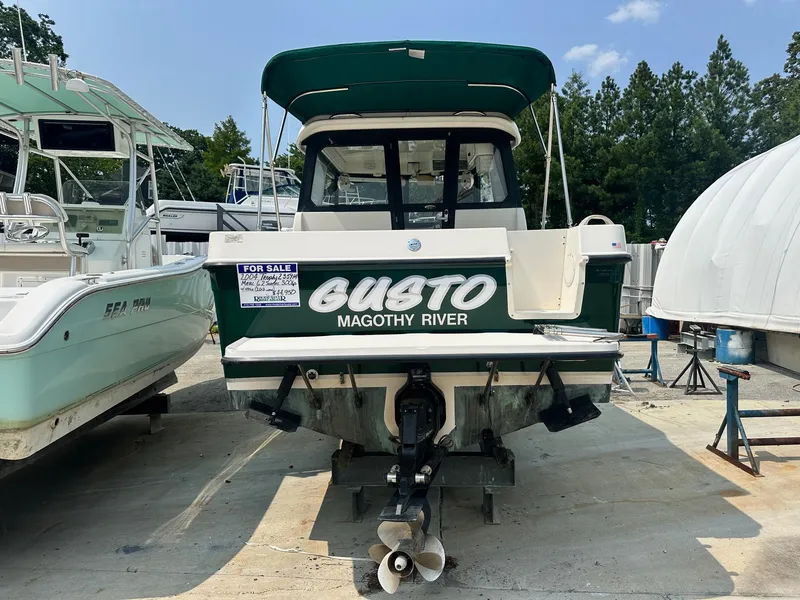 Slide: The Image of 2004 Trophy 2359 Hardtop boat for sale, rear view with "Gusto" name. - 3