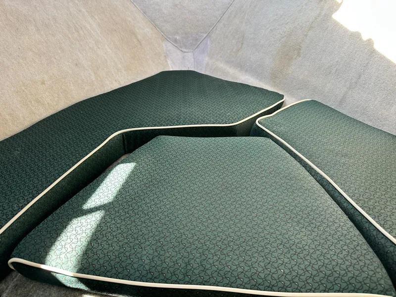 Slide: The Image of Interior of a 2004 Trophy 2359 Hardtop boat, featuring helm and seating area. - 35