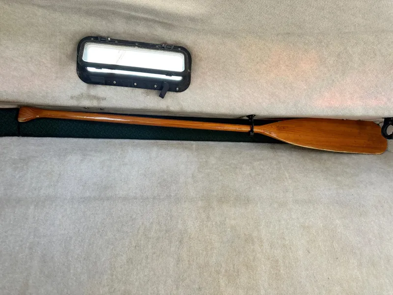 Slide: The Image of 2004 Trophy 2359 Hardtop boat interior with seating and storage compartments. - 36