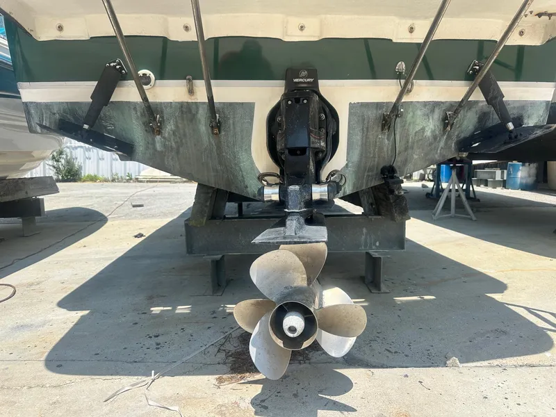 Slide: The Image of 2004 Trophy 2359 Hardtop boat on display at a marina. - 5