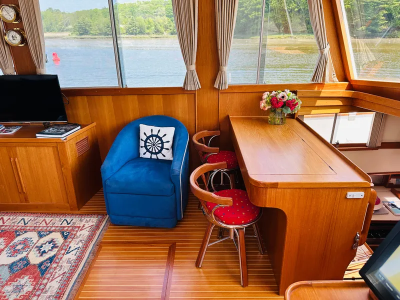 Slide: The Image of Interior of 1998 Grand Banks 49 Classic yacht with wooden decor and scenic window view. - 25