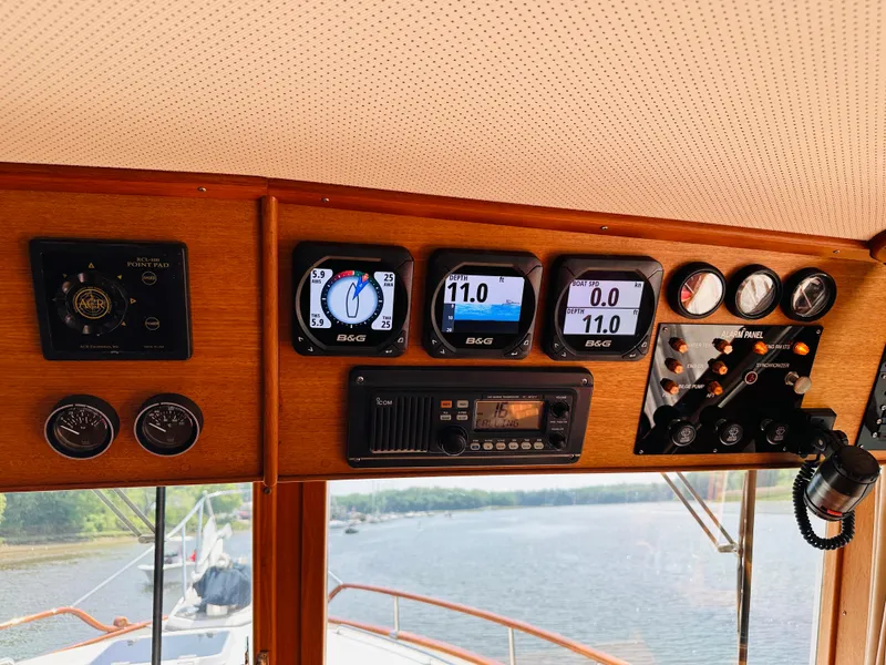 Slide: The Image of Control panel of a 1998 Grand Banks 49 Classic yacht with navigation instruments. - 31