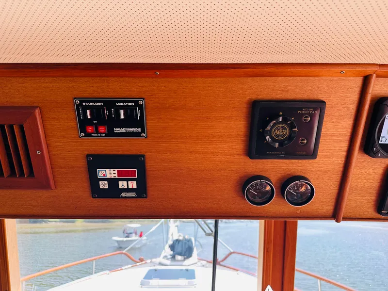 Slide: The Image of Control panel of a 1998 Grand Banks 49 Classic yacht with navigation instruments. - 32