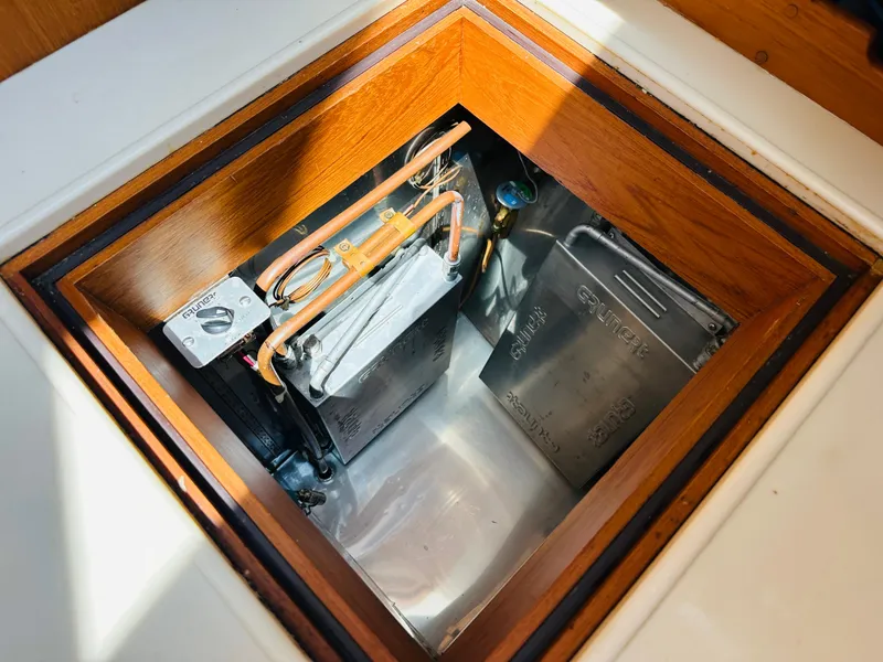 Slide: The Image of Engine compartment of 1998 Grand Banks 49 Classic yacht, showcasing mechanical components. - 42