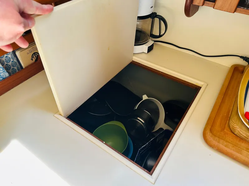 Slide: The Image of Hidden storage compartment in 1998 Grand Banks 49 Classic yacht kitchen. - 43