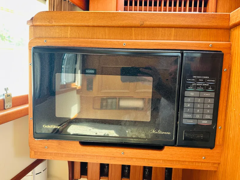 Slide: The Image of GoldStar microwave in 1998 Grand Banks 49 Classic yacht kitchen. - 44