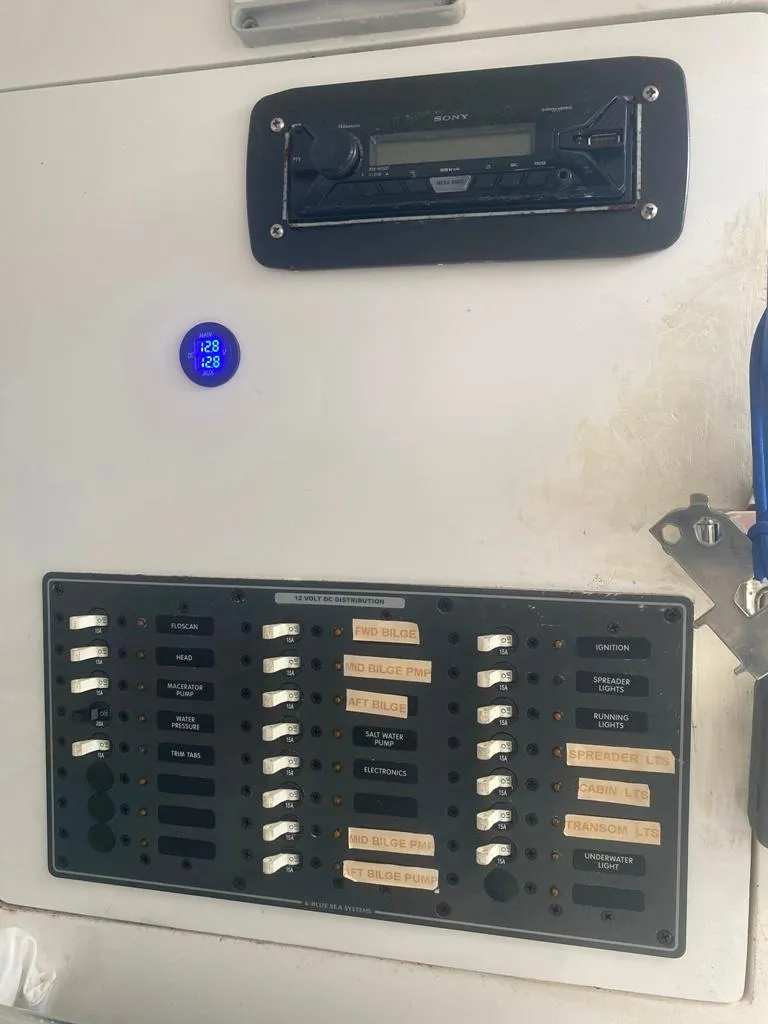 Slide: The Image of Electrical panel and stereo system on a 1970 Bertram 31 Bahia Mar boat. - 19