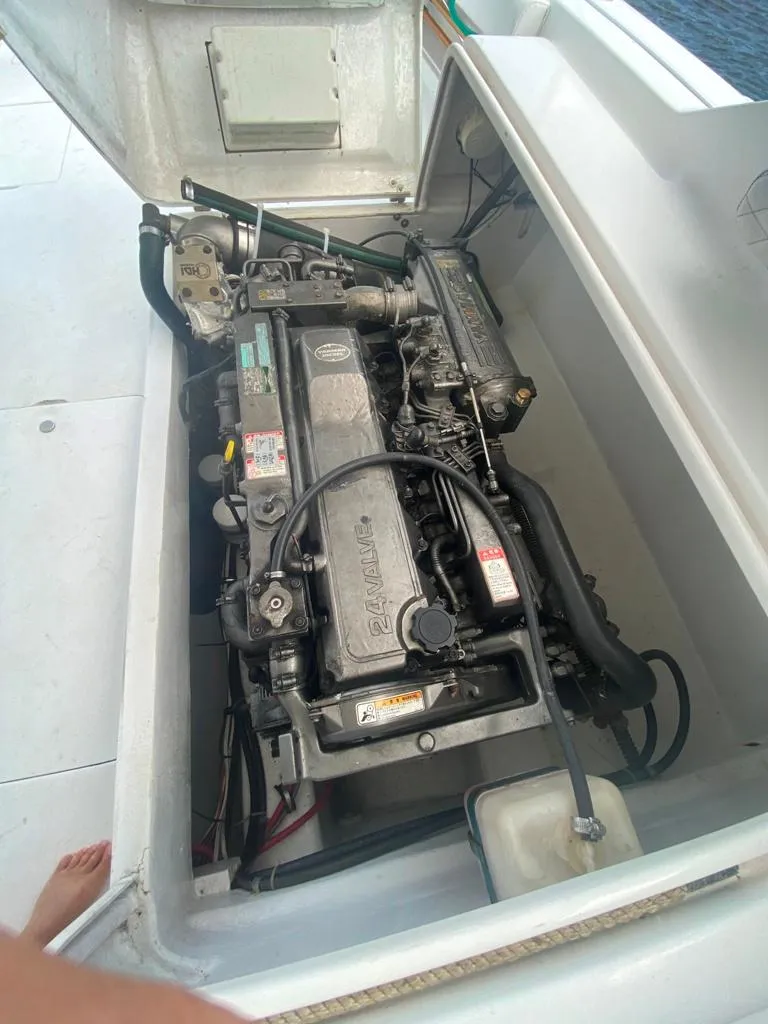 Slide: The Image of Engine compartment of a 1970 Bertram 31 Bahia Mar boat, showcasing detailed machinery. - 22