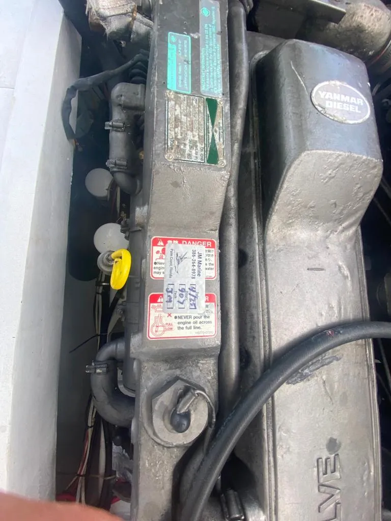 Slide: The Image of 1970 Bertram 31 Bahia Mar engine close-up with visible labels and components. - 23