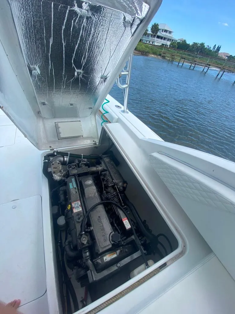 Slide: The Image of 1970 Bertram 31 Bahia Mar engine compartment by the water. - 24