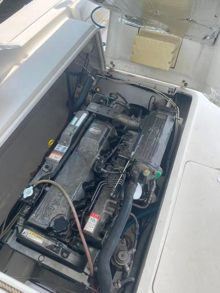 Slide: The Image of 1970 Bertram 31 Bahia Mar engine compartment with visible components and wiring. - 28
