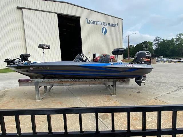 The Image of 2016 Triton 179 TrX boat at Lighthouse Marina, parked on a stand. - 1