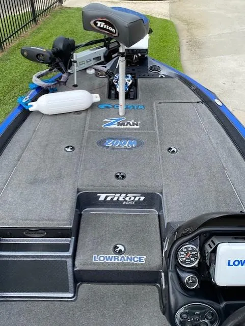 Slide: The Image of 2016 Triton 179 TrX boat deck with fishing gear and Lowrance electronics. - 10