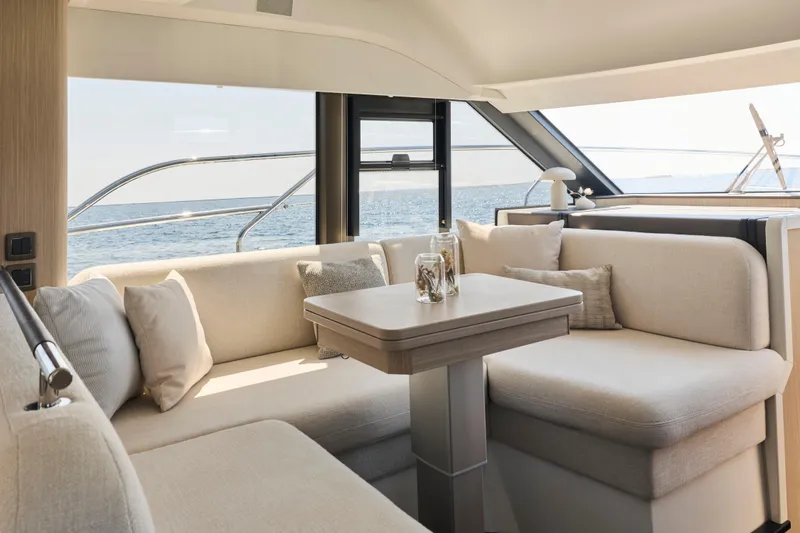 Slide: The Image of Luxurious interior of 2026 Prestige F4.3 yacht with ocean view and elegant seating. - 10