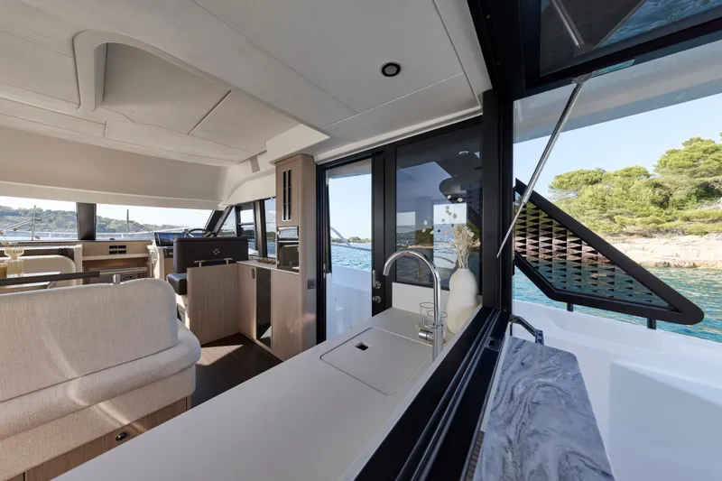 Slide: The Image of Luxurious interior of 2026 Prestige F4.3 yacht with modern design and scenic ocean view. - 11