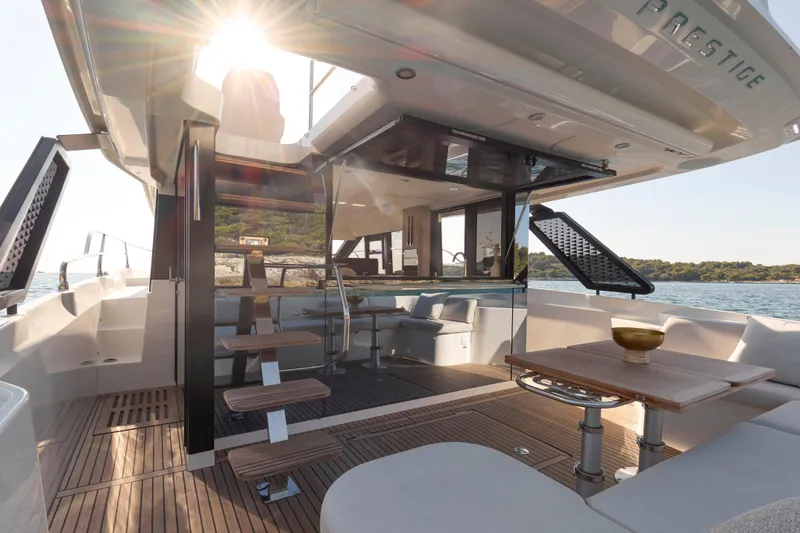 Slide: The Image of Luxurious 2026 Prestige F4.3 yacht interior with modern design and sunlit deck. - 12