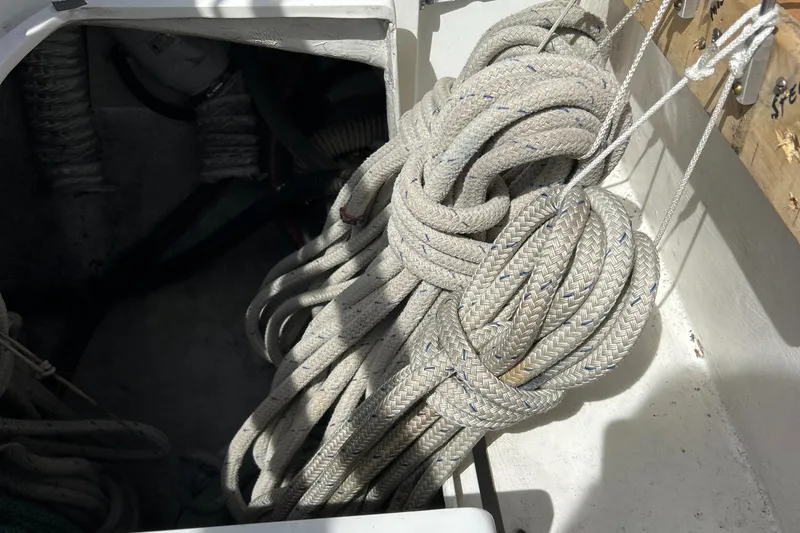 Slide: The Image of Coiled ropes in a 1998 Catalina 36MKII sailboat storage compartment. - 13