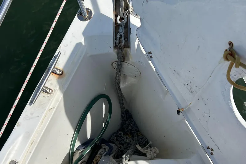 Slide: The Image of Anchor chain storage on 1998 Catalina 36MKII sailboat deck. - 2