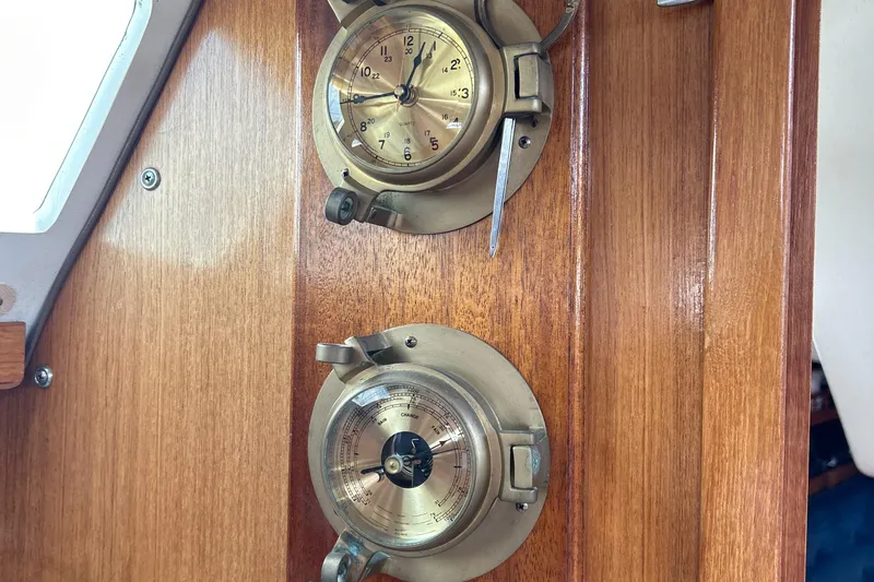 Slide: The Image of Brass clock and barometer on Catalina 36MKII yacht's wooden interior, 1998 model. - 36