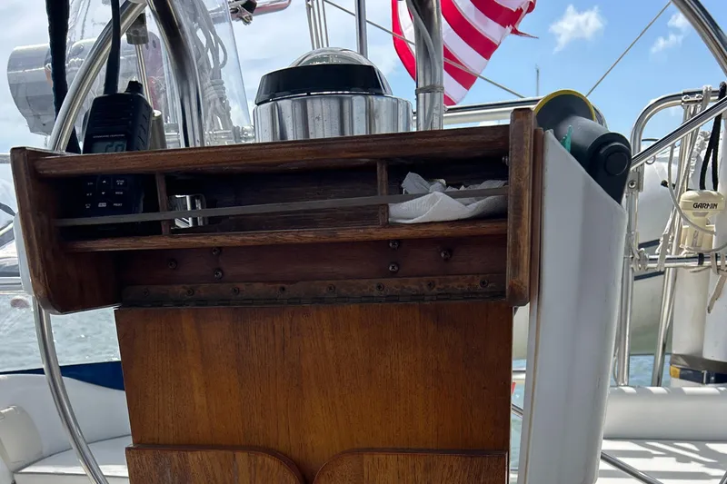 Slide: The Image of Cockpit of 1998 Catalina 36MKII sailboat with wooden panel and American flag. - 38