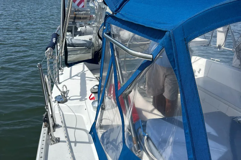 Slide: The Image of Catalina 36MKII sailboat, 1998 model, with blue canopy on calm water. - 9