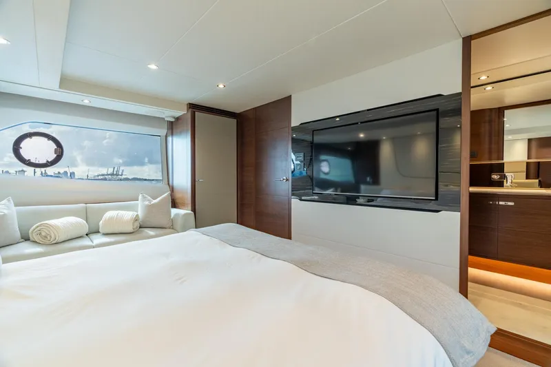 Slide: The Image of Luxurious interior of 2019 Princess F70 yacht with modern bedroom and large window view. - 10