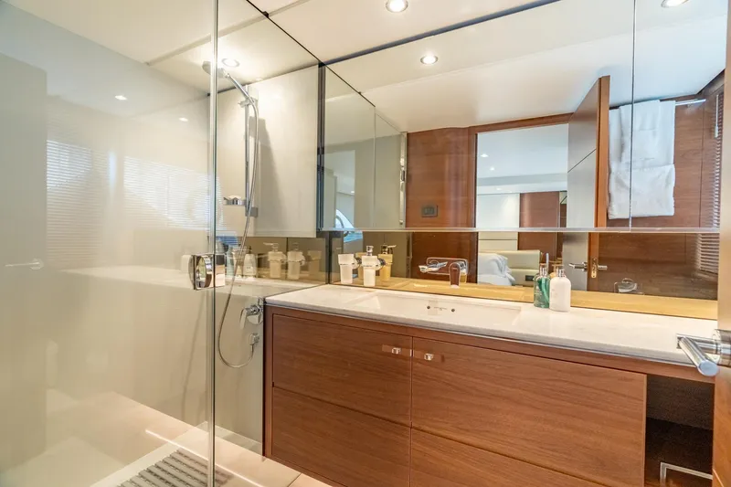 Slide: The Image of Luxurious bathroom in 2019 Princess F70 yacht with modern fixtures and wooden cabinetry. - 11