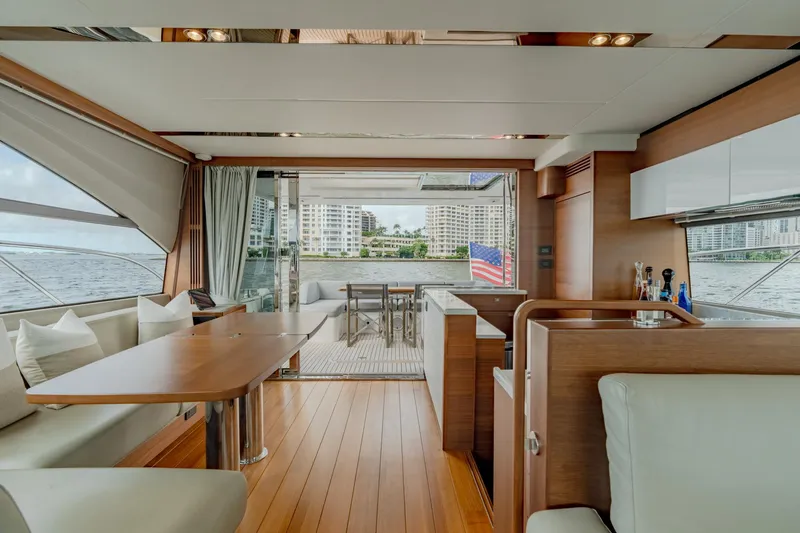 Slide: The Image of Luxurious interior of 2019 Princess F70 yacht with elegant dining area and scenic water views. - 16