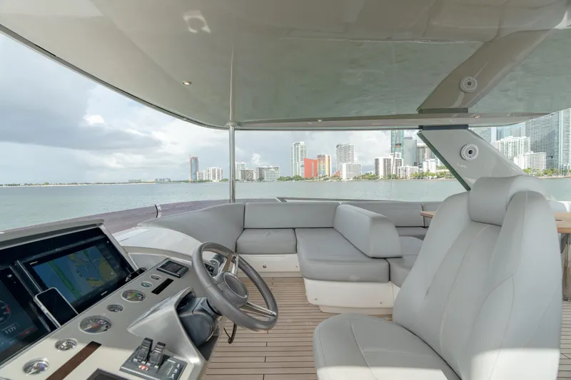 Slide: The Image of Luxurious 2019 Princess F70 yacht interior with modern helm, overlooking city skyline and ocean. - 23