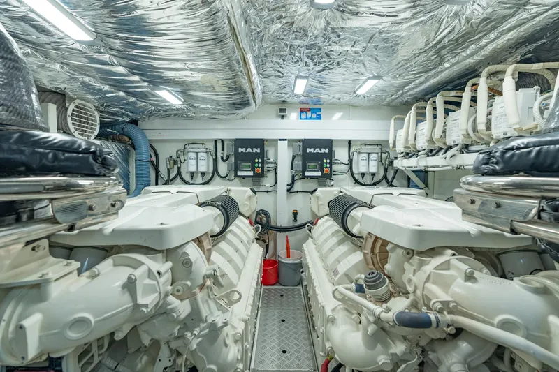 Slide: The Image of Engine room of a 2019 Princess F70 yacht, featuring dual MAN engines. - 25