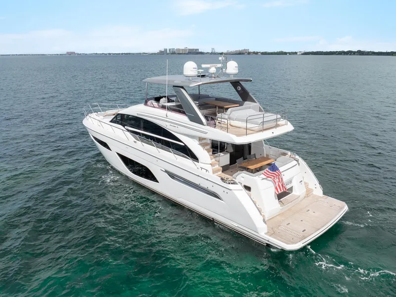 Slide: The Image of Luxurious 2019 Princess F70 yacht cruising on open water, showcasing elegant design and spacious deck. - 26