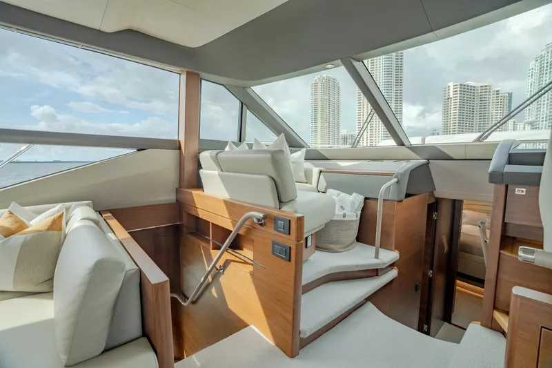 Slide: The Image of Luxurious interior of 2019 Princess F70 yacht with modern seating and cityscape view. - 5