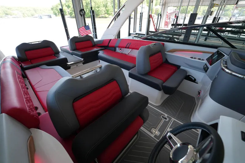 Slide: The Image of Luxurious interior of 2025 Regal LS9 boat with red and gray seating. - 11