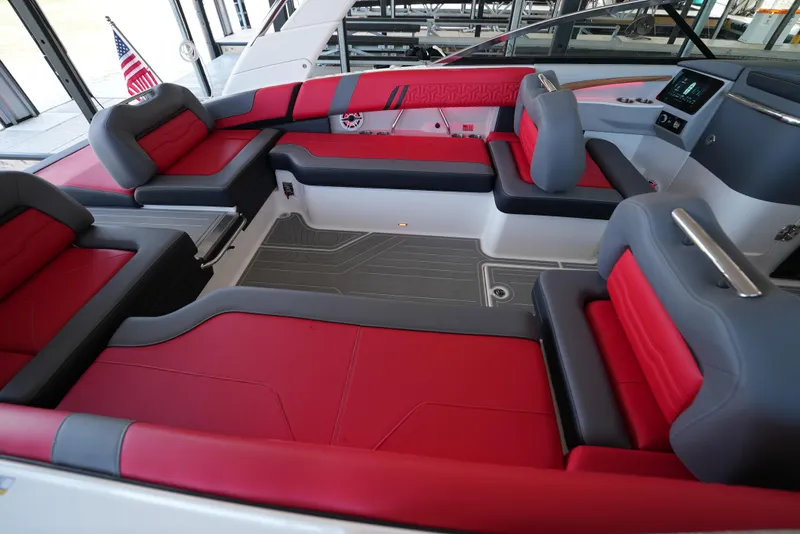 Slide: The Image of Luxurious 2025 Regal LS9 boat interior with red and gray seating, modern design. - 12