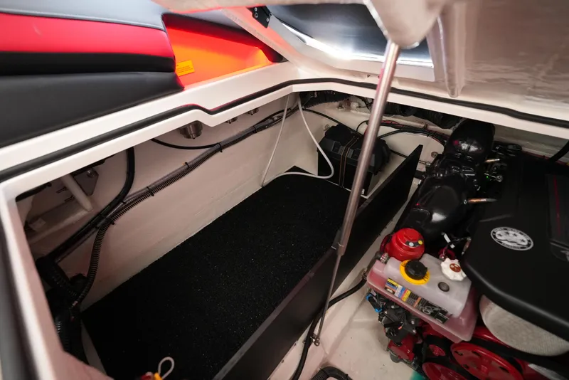 Slide: The Image of Engine compartment of 2025 Regal LS9 boat, showcasing mechanical components and storage area. - 22