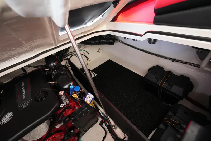 Slide: The Image of Engine compartment of 2025 Regal LS9 boat, showcasing battery and mechanical components. - 23