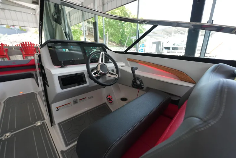 Slide: The Image of Interior of 2025 Regal LS9 boat, featuring modern steering and dashboard controls. - 30